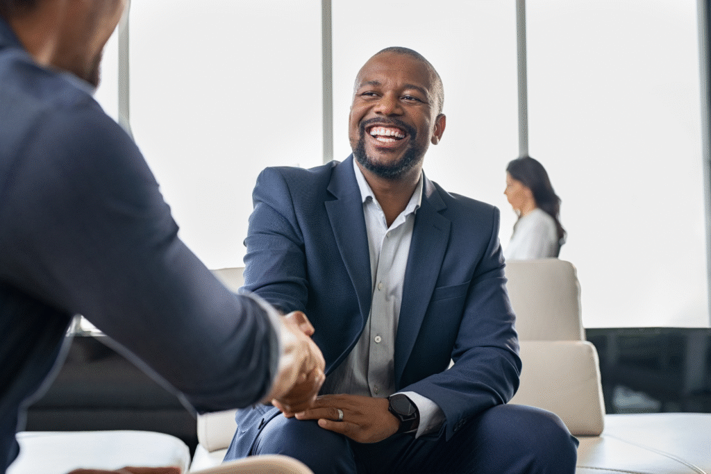 Two business professionals shaking hands.