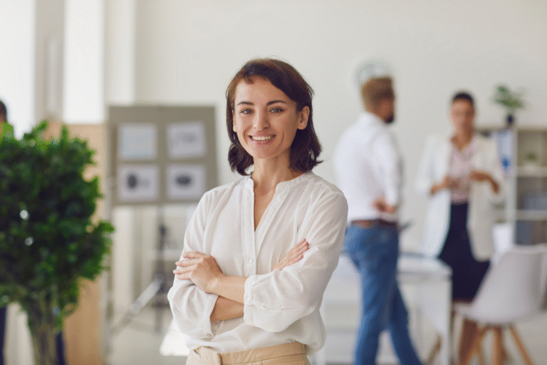 A business owner smiling at the camera.