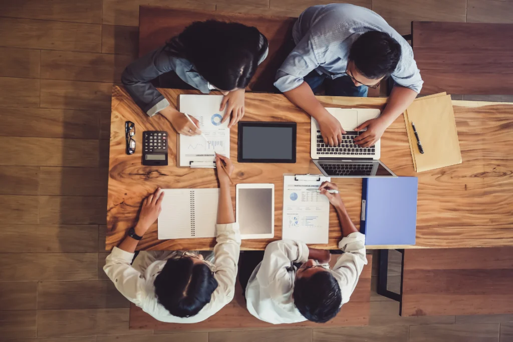 marketing team preparing business listing with broker