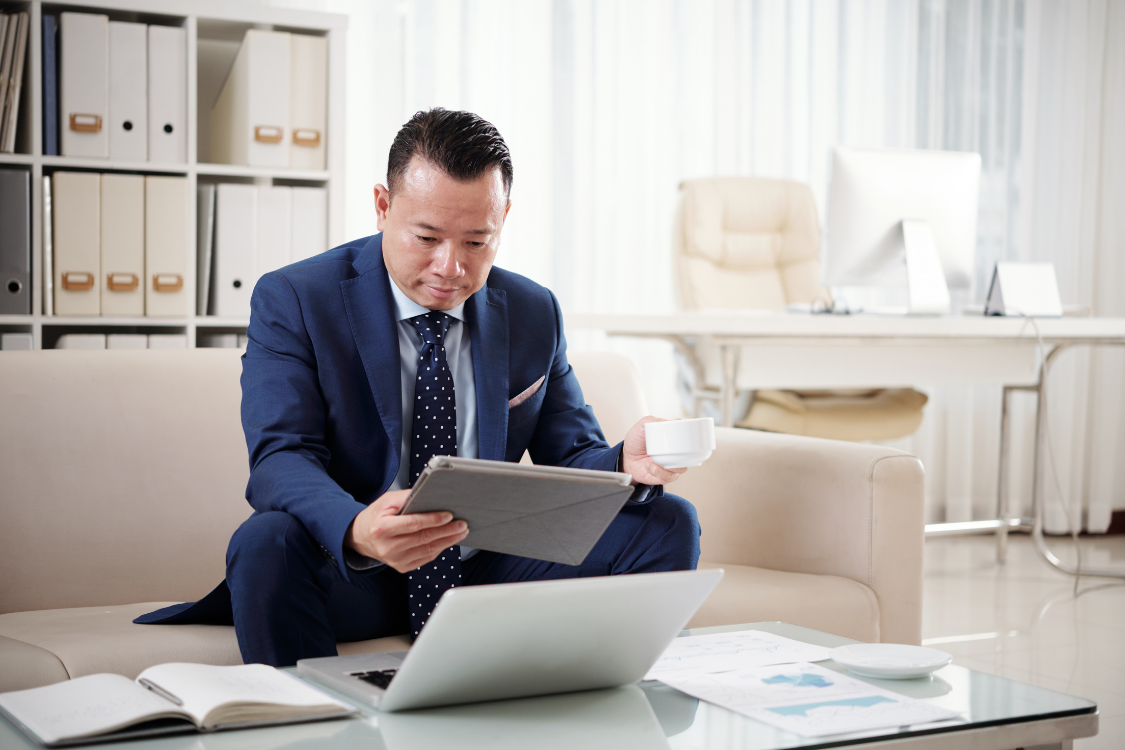 Business owner reviewing client references for a business broker