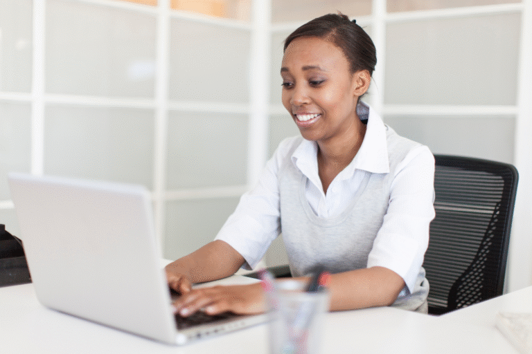 Person writing a broker reference outreach email at desk