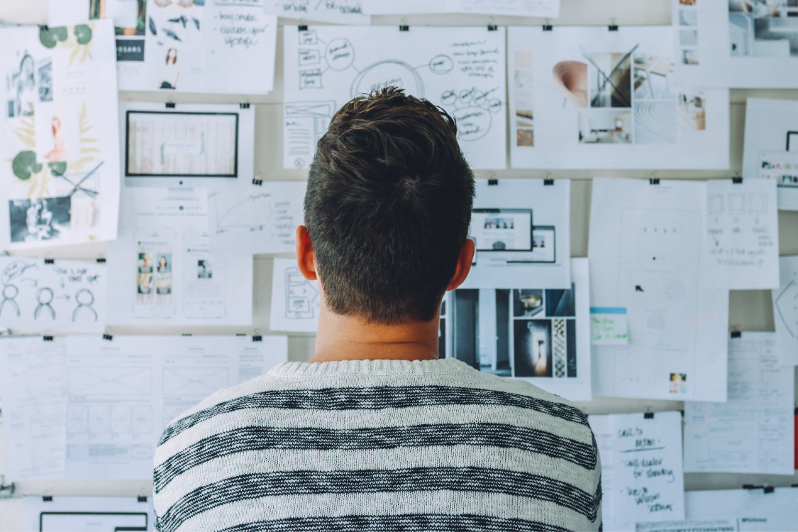 Business expert decoding broker jargon on a whiteboard