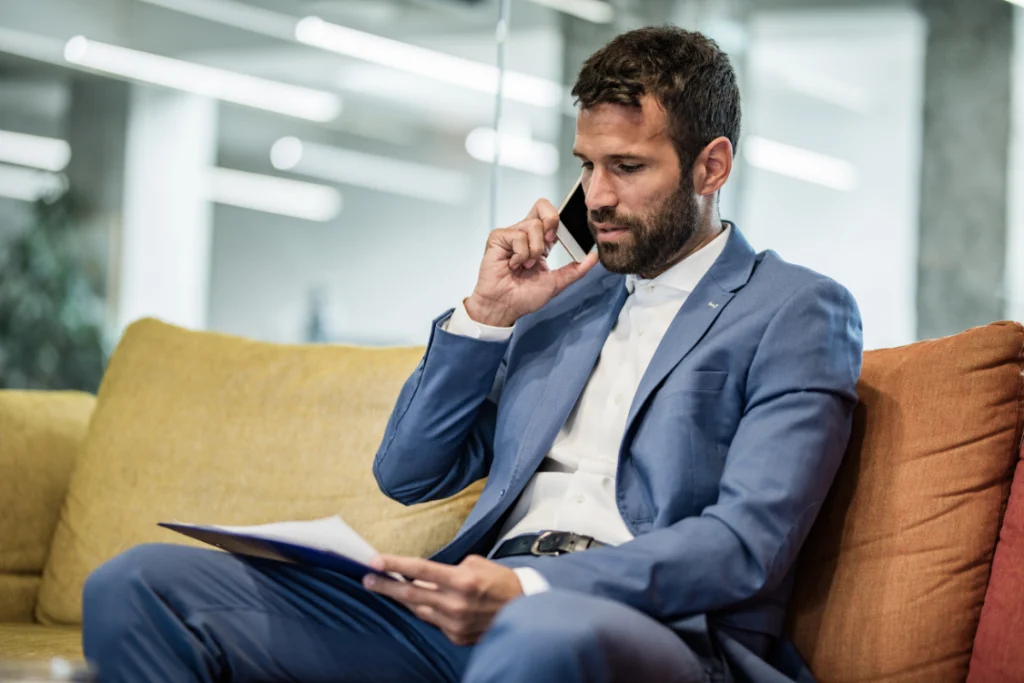 Investor questioning online broker reviews while checking documents