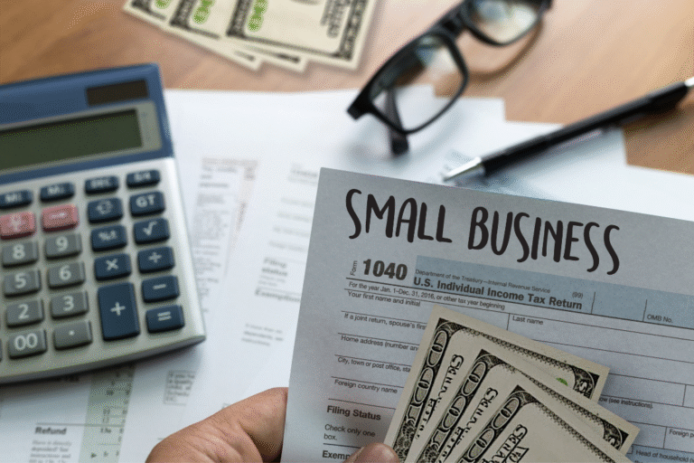 Small business tax documents and cash prepared for business sale process