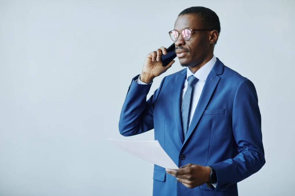 Business owner on a reference call with a testimonial beside them