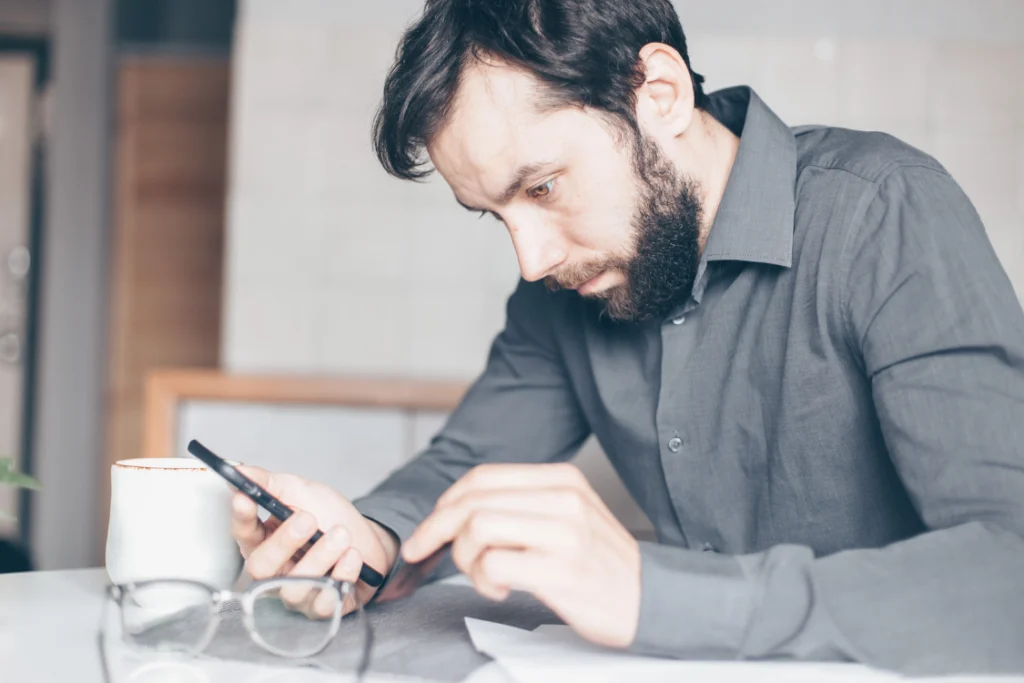 Frustrated seller waiting on broker replies during business sale