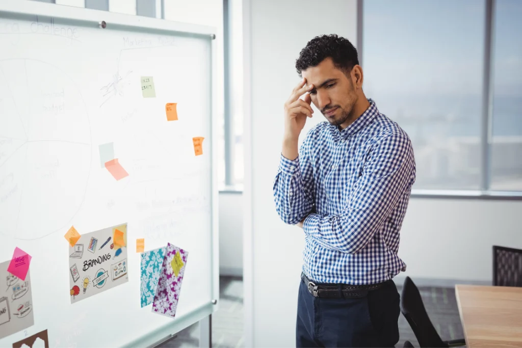 Business owner weighing broker decision after spotting red flags