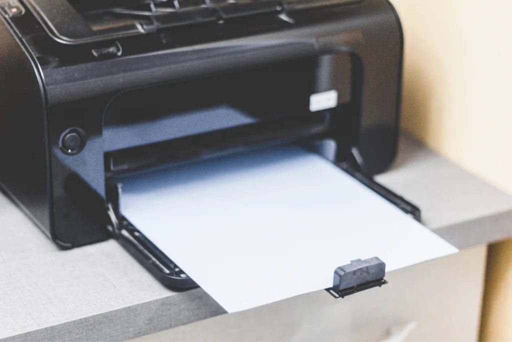 Printer producing a document after finalizing an engagement letter for selling a business.