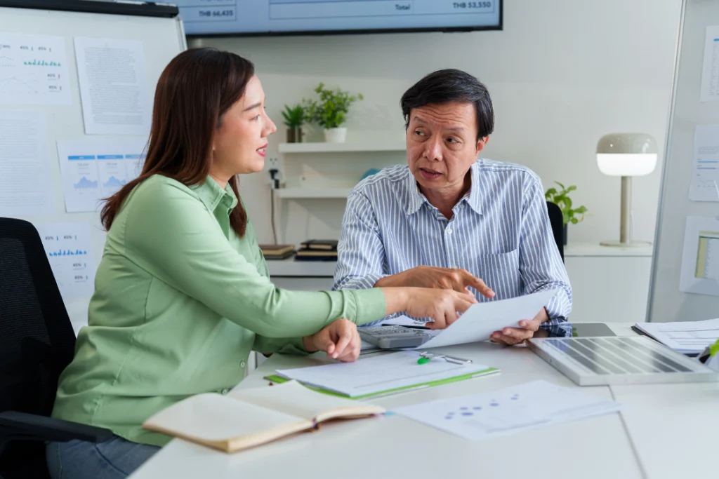 Business broker explaining deal terms to client while discussing SMB broker tiebreaker question results.