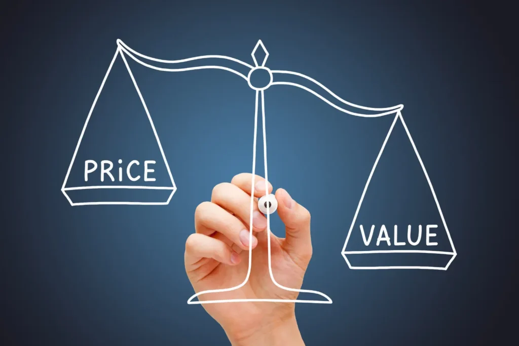 Drawing of a hand balancing a scale with "PRICE" on one side and "VALUE" on the other, representing the core concept of a business valuation and fair market value.