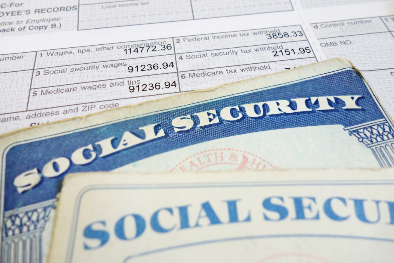 Social Security cards and tax wage statement illustrating income data used in how to calculate wealth gap.