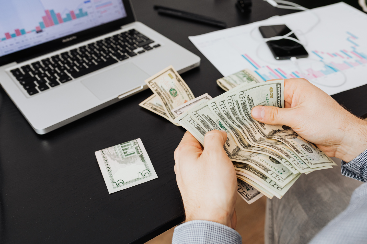 A person documenting business earnings.